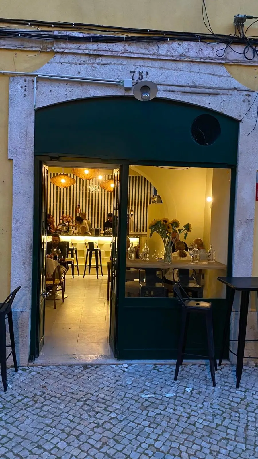 The Runa façade at Rua de Pedrouços 75D, with its green door